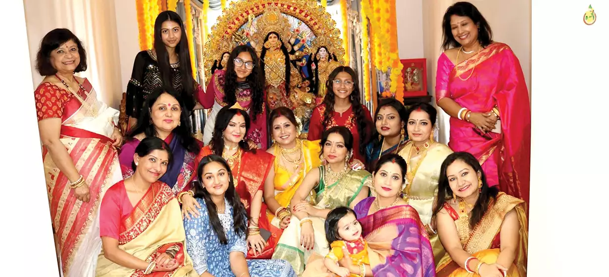 Community Gathers for Family-Hosted Durga Puja D