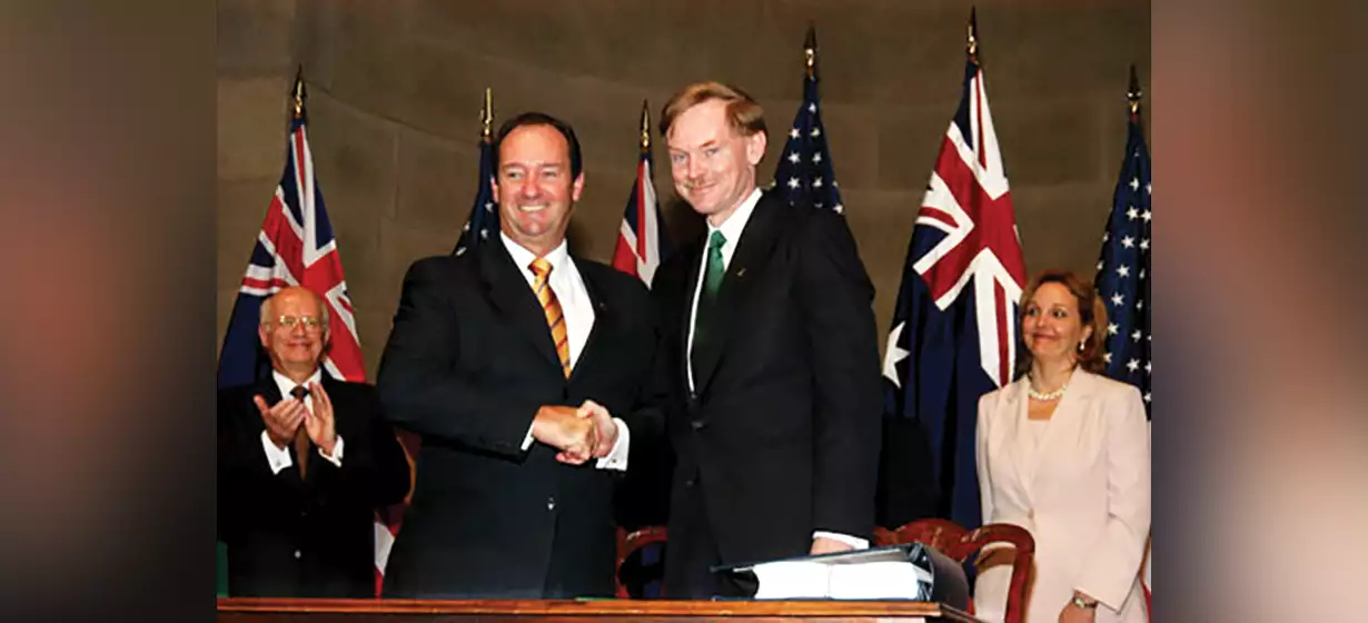 Minister for Trade, Mark Vaile (left) and United States trade representative Robert Zoellick (right) after signing the AUSFTA, Washington DC (2)